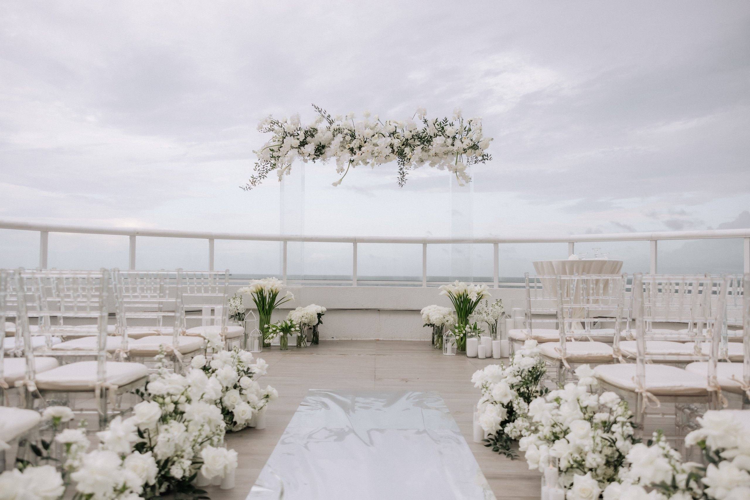 White ceremony setup on a rooftop