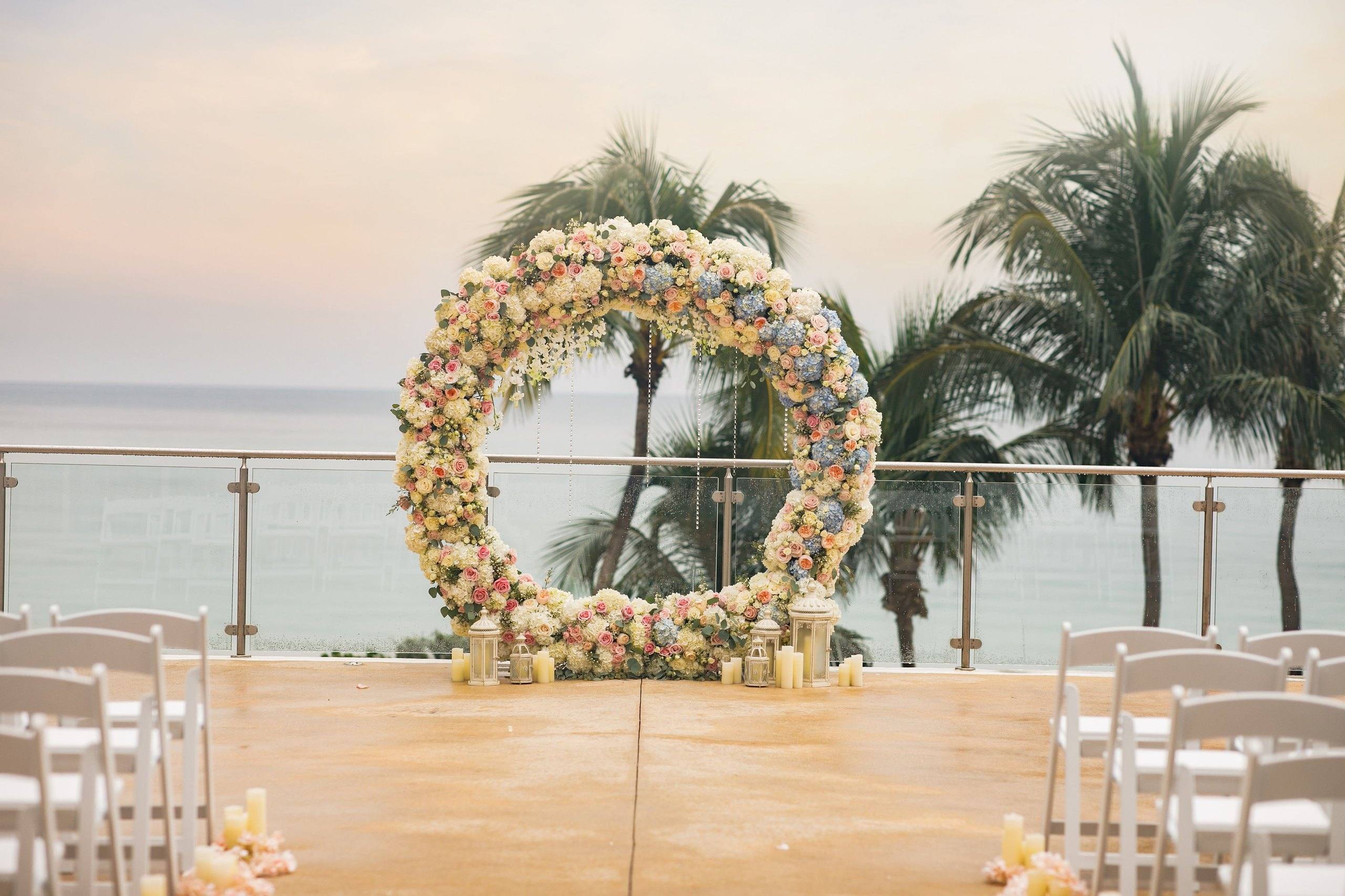 Floral circle arch on a rooftop