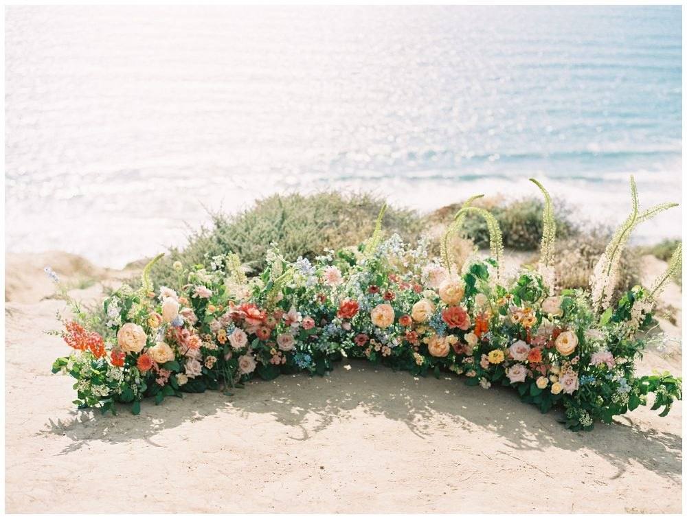 Semi circle of ground flowers on a dune