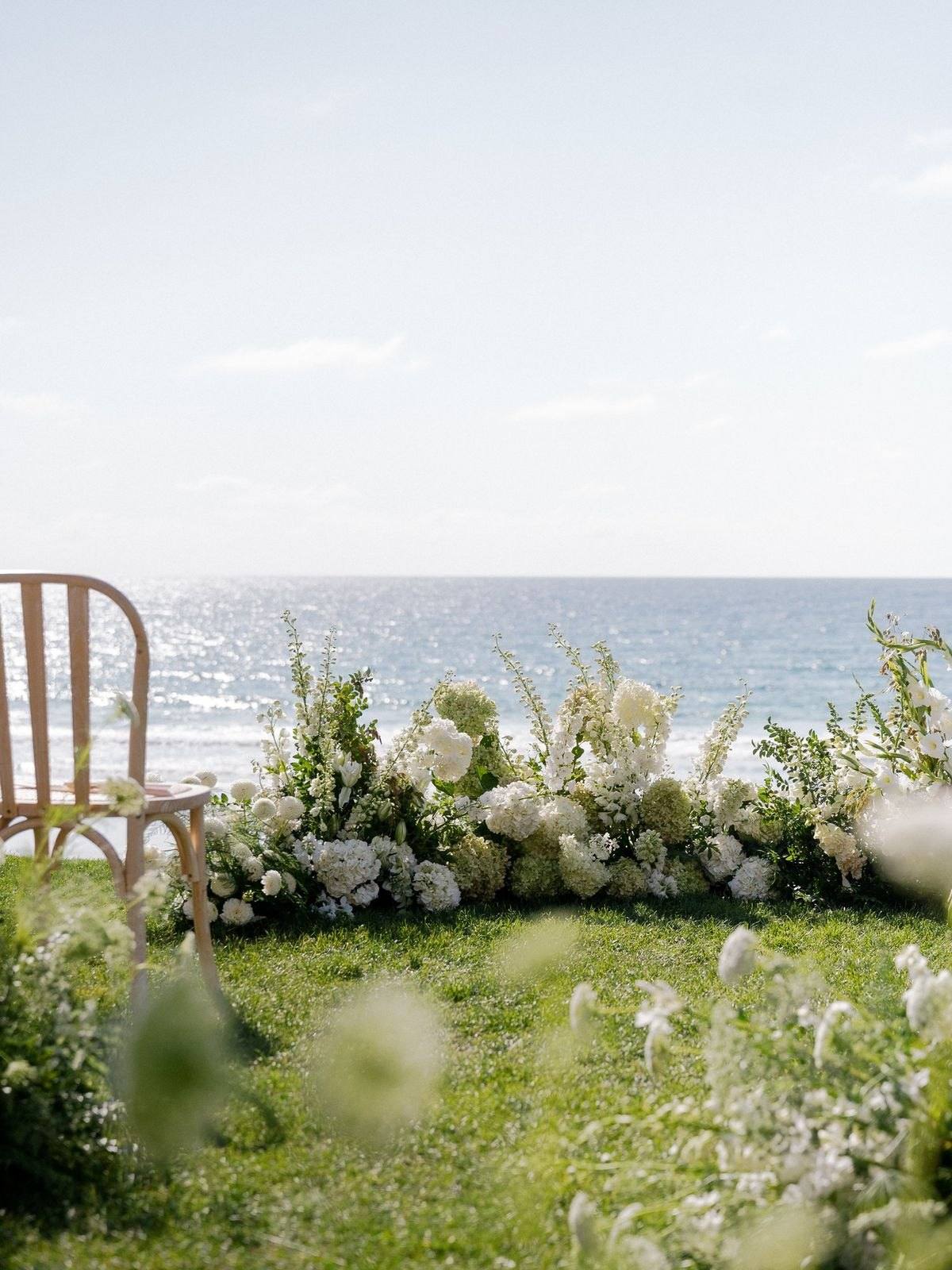 Garden style semi circle of flowers and greenery